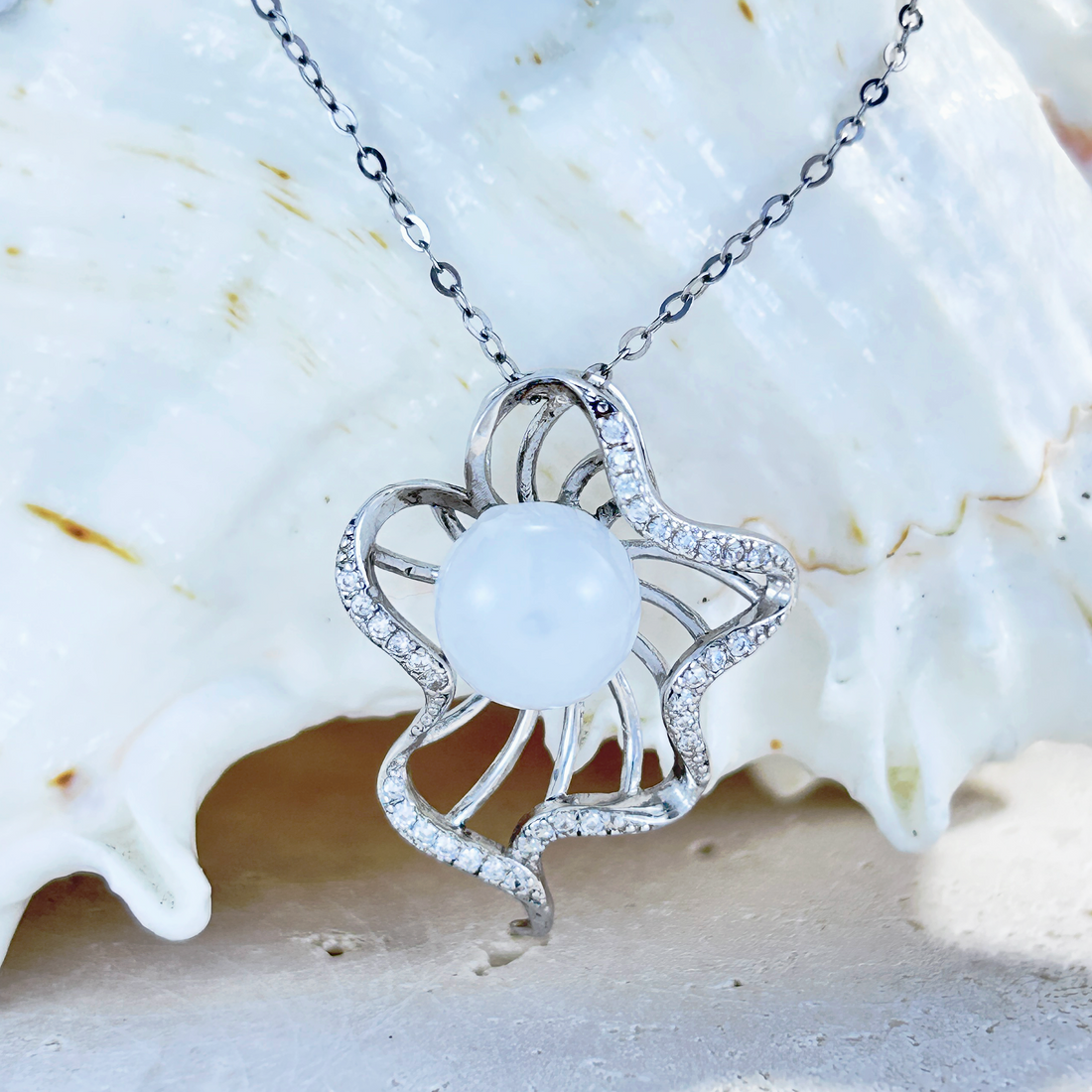 Elegant essential oil necklace with a white orb, medusa-inspired design, perfect for diffuser jewellery