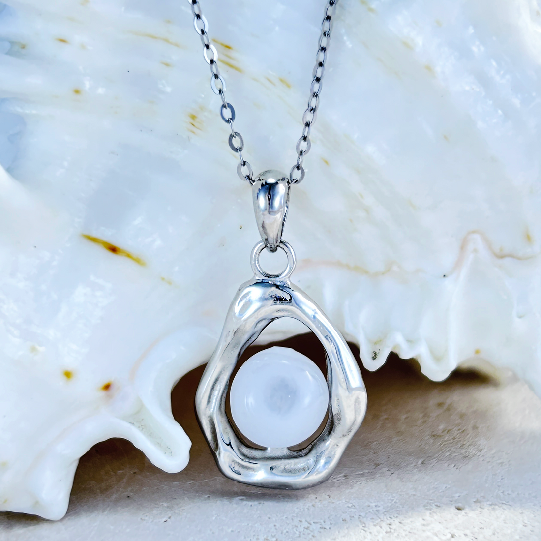 Lunar Shell aromatherapy jewellery by Lilanimus, white gold-plated diffuser necklace for peace and balance
